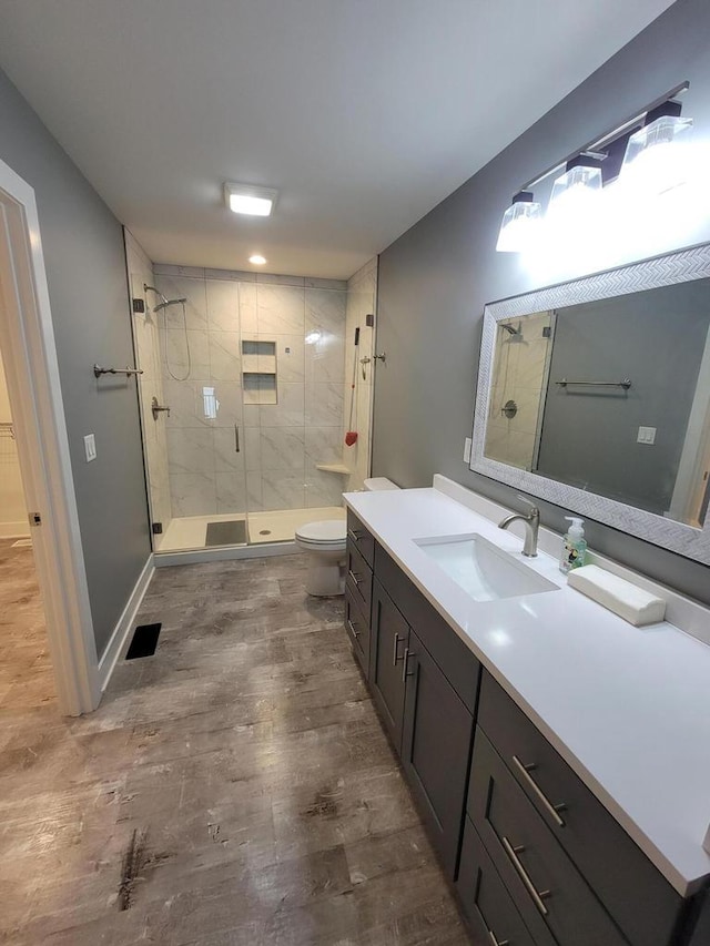 9435 402nd Ave, Genoa City, WI 53128 - full bath with a stall shower, toilet, vanity, and wood finished floors