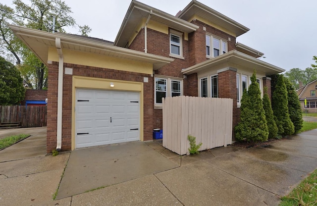 3524 Washington Ave, Racine, WI 53402 - view of front of property with brick siding, concrete driveway, and a garage