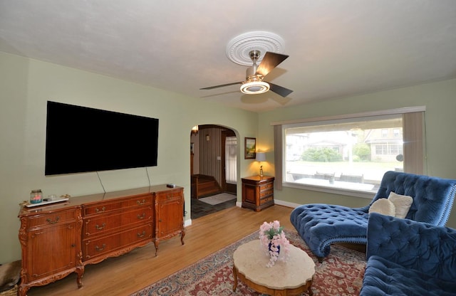 3524 Washington Ave, Racine, WI 53402 - living area featuring light wood-style flooring, arched walkways, and a ceiling fan