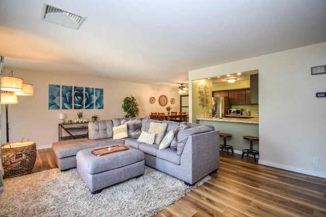 2116 Woodburn Rd Unit B, Waukesha, WI 53188 - living room with wood finished floors, a ceiling fan, and baseboards