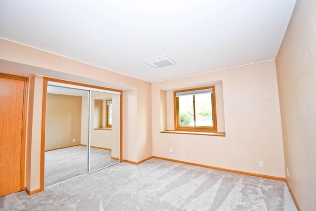 2116 Woodburn Rd Unit B, Waukesha, WI 53188 - unfurnished bedroom featuring carpet, baseboards, and a closet