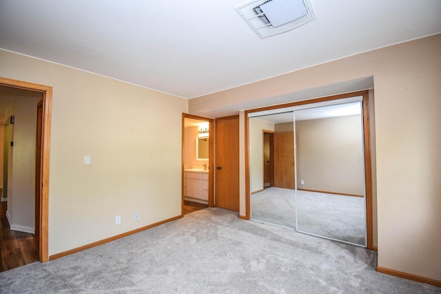 2116 Woodburn Rd Unit B, Waukesha, WI 53188 - unfurnished bedroom with carpet floors, a closet, and baseboards