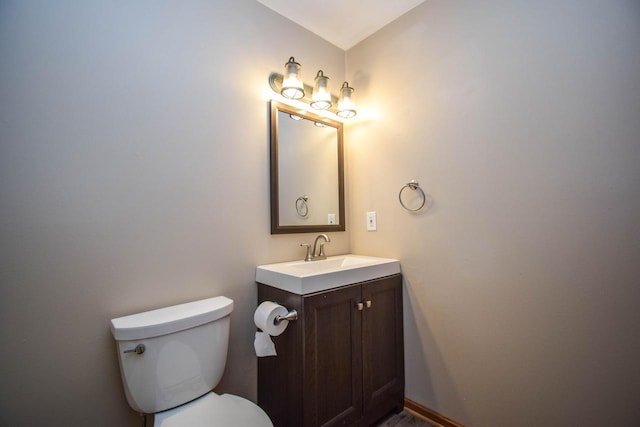2116 Woodburn Rd Unit B, Waukesha, WI 53188 - bathroom featuring vanity, toilet, and baseboards