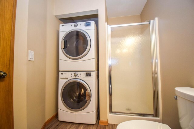 2116 Woodburn Rd Unit B, Waukesha, WI 53188 - washroom featuring stacked washer / drying machine and wood finished floors