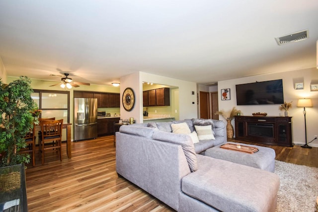2116 Woodburn Rd Unit B, Waukesha, WI 53188 - living room featuring light wood-style flooring and ceiling fan