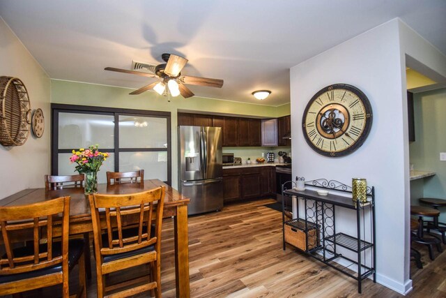 2116 Woodburn Rd Unit B, Waukesha, WI 53188 - dining space featuring light wood finished floors and ceiling fan
