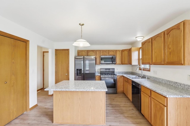 24434 88th St, Salem, WI 53168 - kitchen with appliances with stainless steel finishes, a sink, light stone counters, and light wood-style flooring