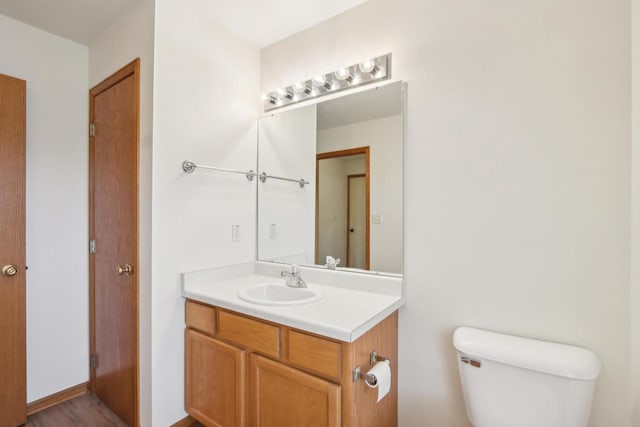 24434 88th St, Salem, WI 53168 - half bathroom featuring vanity and toilet