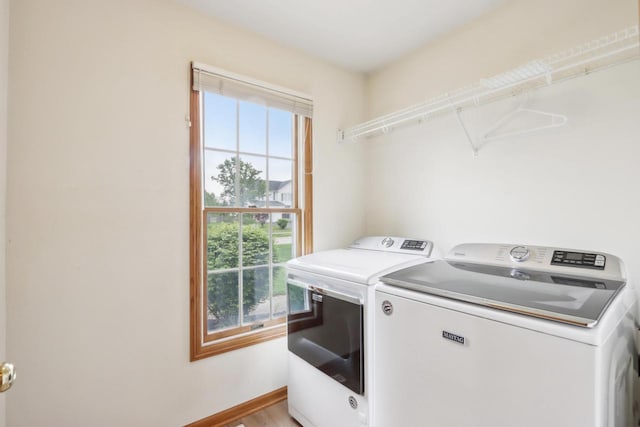 24434 88th St, Salem, WI 53168 - washroom featuring washer and clothes dryer, baseboards, and light wood finished floors