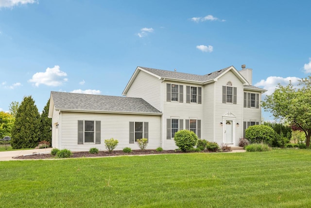 24434 88th St, Salem, WI 53168 - colonial house featuring a chimney and a front yard