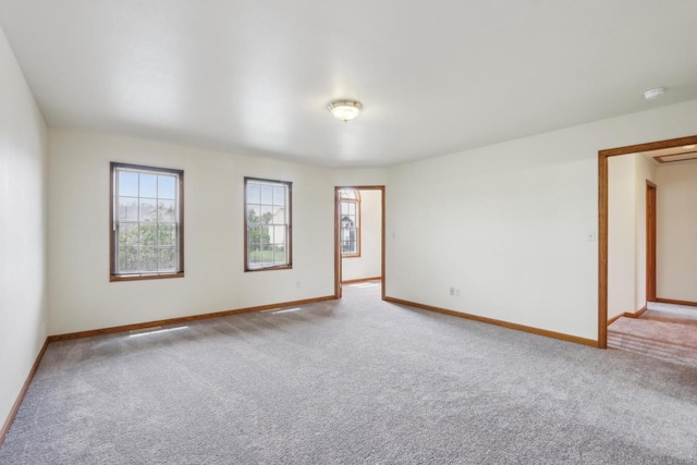 24434 88th St, Salem, WI 53168 - spare room with healthy amount of natural light, carpet flooring, baseboards, and a smoke detector