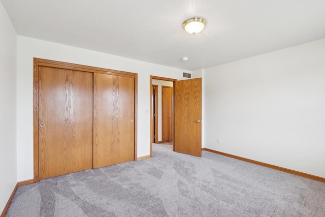 24434 88th St, Salem, WI 53168 - unfurnished bedroom with carpet, baseboards, and a closet