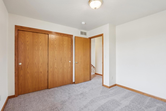 24434 88th St, Salem, WI 53168 - unfurnished bedroom featuring carpet flooring, baseboards, and a closet