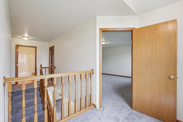 24434 88th St, Salem, WI 53168 - corridor with an upstairs landing, carpet flooring, and baseboards