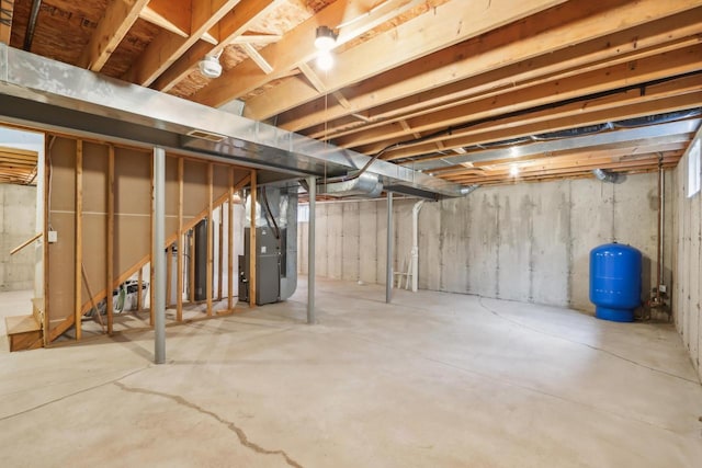 24434 88th St, Salem, WI 53168 - unfinished below grade area with a water pressure tank and heating unit