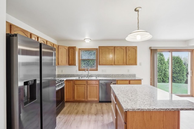 24434 88th St, Salem, WI 53168 - kitchen with appliances with stainless steel finishes, a sink, healthy amount of natural light, and light wood-style floors