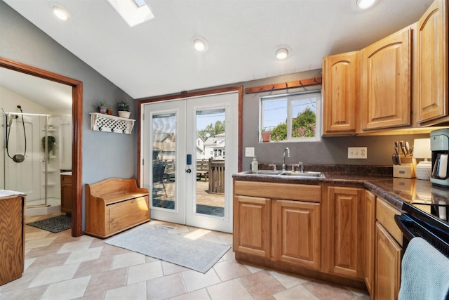 273 5th St, Fond Du Lac, WI 54935 - kitchen featuring a sink, french doors, vaulted ceiling, dark countertops, and recessed lighting