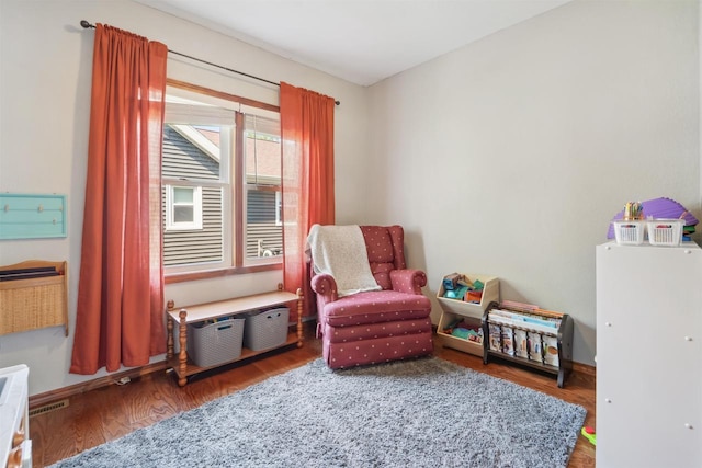 273 5th St, Fond Du Lac, WI 54935 - sitting room with wood finished floors and baseboards