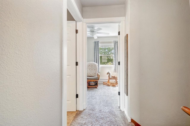 273 5th St, Fond Du Lac, WI 54935 - corridor with a textured wall and light colored carpet