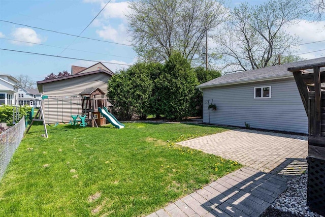 273 5th St, Fond Du Lac, WI 54935 - view of yard featuring a playground and a patio area