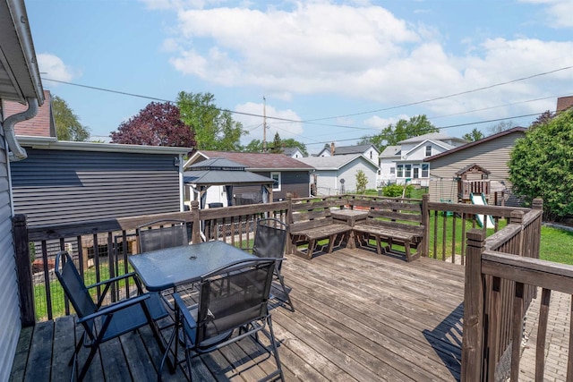 273 5th St, Fond Du Lac, WI 54935 - wooden terrace featuring outdoor dining space, a gazebo, and a residential view