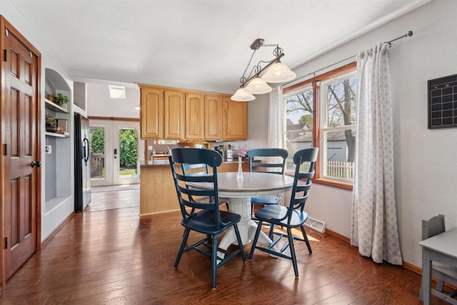 273 5th St, Fond Du Lac, WI 54935 - dining space with plenty of natural light, wood-type flooring, baseboards, and french doors