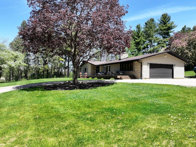 W207S8686 Hillendale Dr, Muskego, WI 53150 - ranch-style home featuring stone siding, concrete driveway, a garage, a front lawn, and covered porch