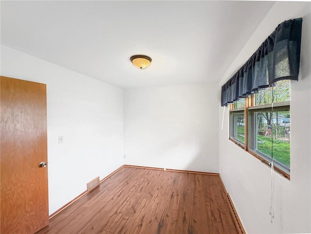 602 26th St, Cloquet, MN 55720 - empty room with wood finished floors and baseboards
