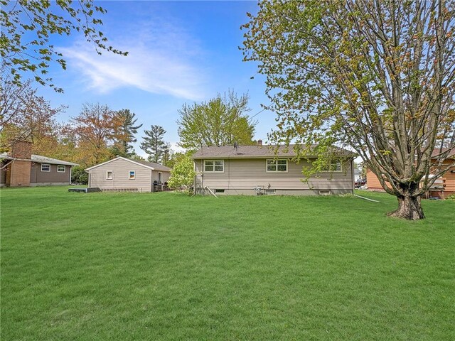 602 26th St, Cloquet, MN 55720 - rear view of property with a yard