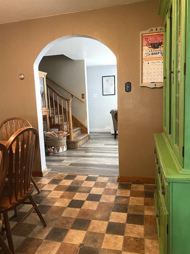 816 Gladstone St, Marinette, WI 54143 - corridor featuring arched walkways, stairway, and baseboards