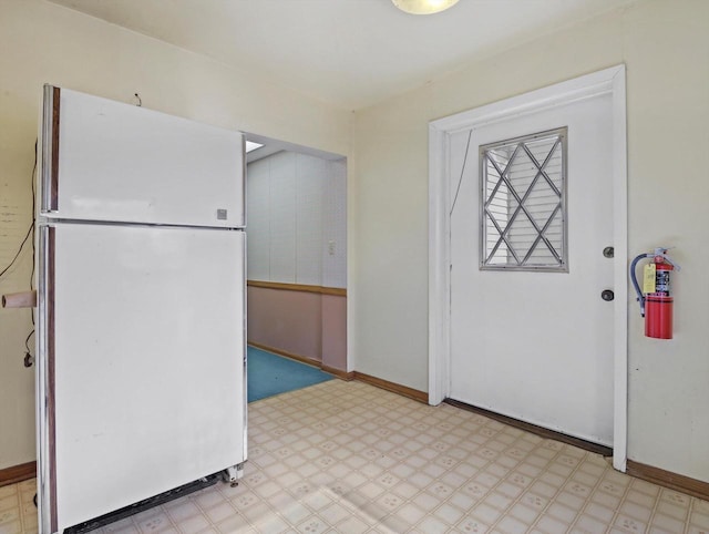 1530 Utah St, Watertown, WI 53094 - kitchen featuring freestanding refrigerator, light flooring, and baseboards