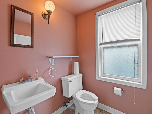 1530 Utah St, Watertown, WI 53094 - bathroom featuring a sink, toilet, baseboards, and tile patterned flooring
