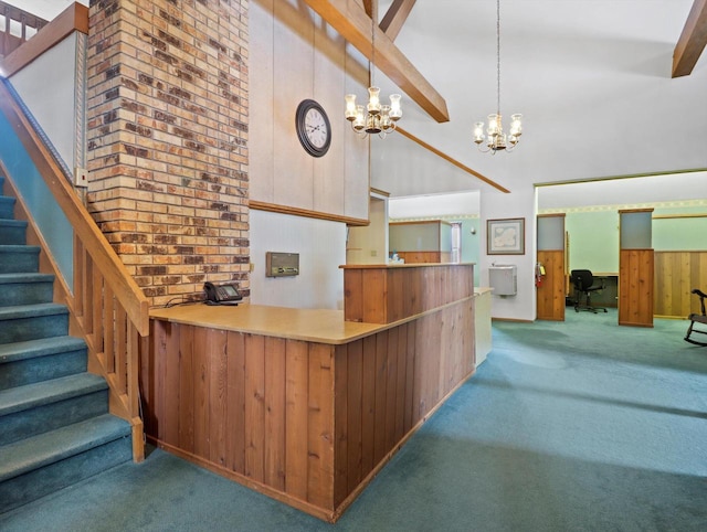 1530 Utah St, Watertown, WI 53094 - kitchen with carpet flooring, a high ceiling, a chandelier, an office area, and wood walls