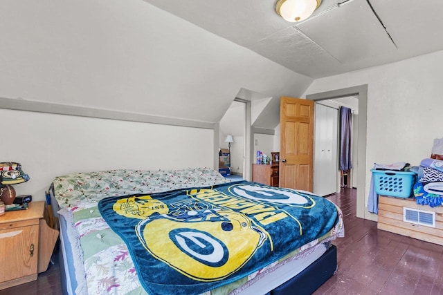 254 Mill St, Algoma, WI 54201 - bedroom featuring vaulted ceiling and dark wood-type flooring