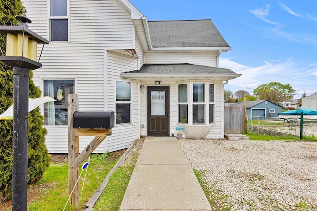 254 Mill St, Algoma, WI 54201 - view of exterior entry featuring roof with shingles