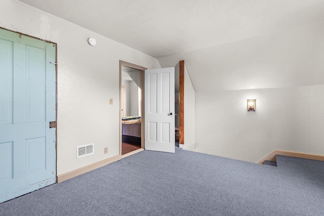 254 Mill St, Algoma, WI 54201 - additional living space featuring carpet floors, vaulted ceiling, and baseboards