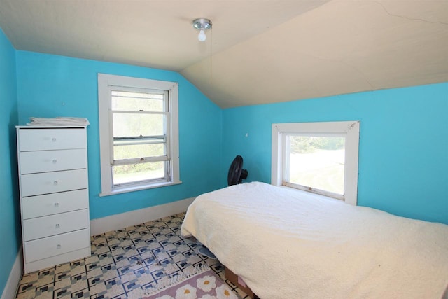 W1796 Puddlefort St, Mount Calvary, WI 53057 - bedroom with vaulted ceiling and tile patterned floors