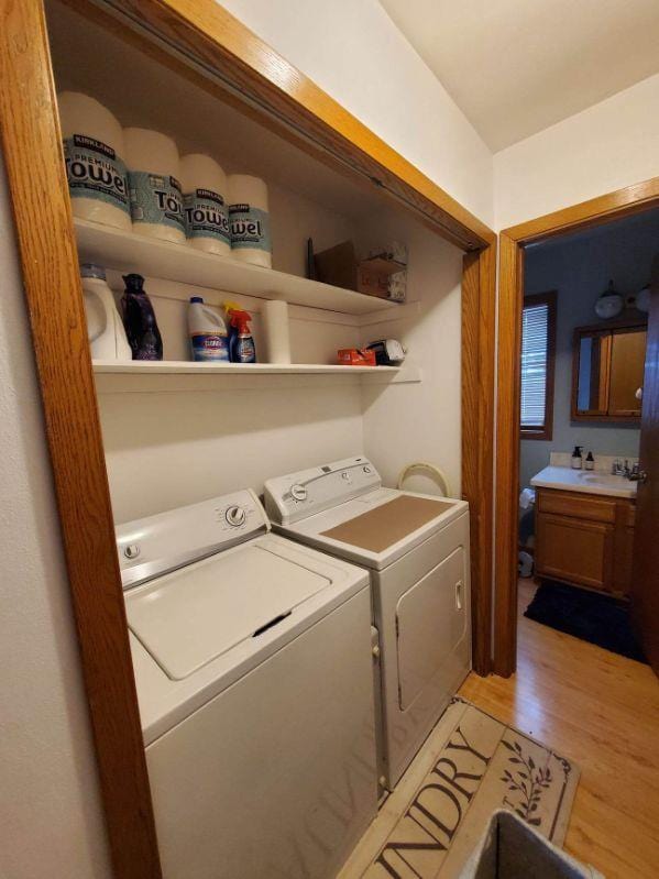 400 Old Indian Trl, Deforest, WI 53532 - washroom with washing machine and dryer and light wood finished floors