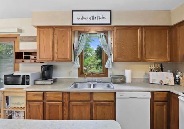 400 Old Indian Trl, Deforest, WI 53532 - kitchen featuring white appliances, a sink, light countertops, and plenty of natural light