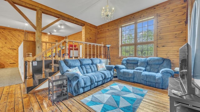 N2289 US Highway 45, Campbellsport, WI 53010 - living area with wooden walls, hardwood / wood-style floors, a chandelier, and stairway