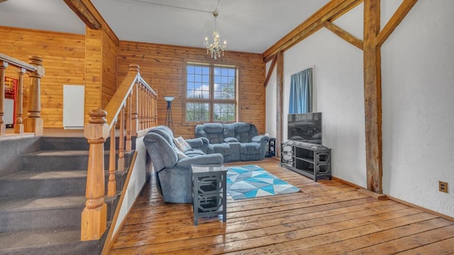 N2289 US Highway 45, Campbellsport, WI 53010 - living room featuring hardwood / wood-style flooring, stairway, a chandelier, wooden walls, and a textured wall