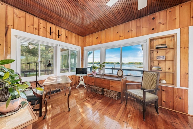 W6641 N Lakeshore Dr, Elkhorn, WI 53121 - sunroom featuring wooden ceiling, wood walls, wood-type flooring, healthy amount of natural light, and a deck