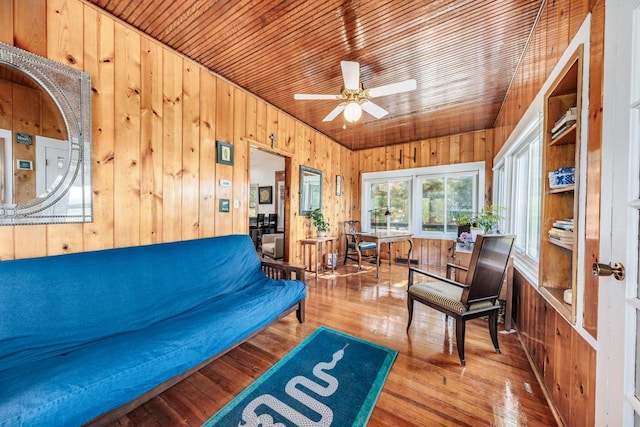 W6641 N Lakeshore Dr, Elkhorn, WI 53121 - living room with wood walls, ceiling fan, wood-type flooring, and wooden ceiling