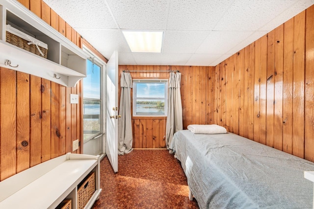 W6641 N Lakeshore Dr, Elkhorn, WI 53121 - bedroom featuring dark carpet and wooden walls