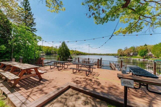 W6641 N Lakeshore Dr, Elkhorn, WI 53121 - wooden deck with a water view and outdoor dining area