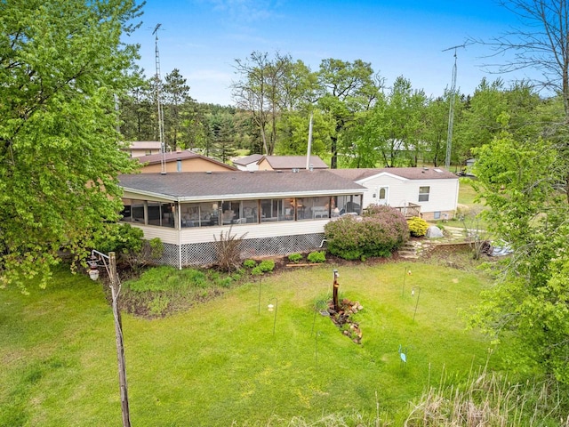 N5101 Lueck Ln, Princeton, WI 54968 - rear view of property featuring a sunroom and a yard