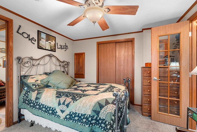 N5101 Lueck Ln, Princeton, WI 54968 - carpeted bedroom with a closet, ornamental molding, and ceiling fan