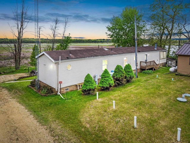 N5101 Lueck Ln, Princeton, WI 54968 - view of property exterior with a yard and a deck