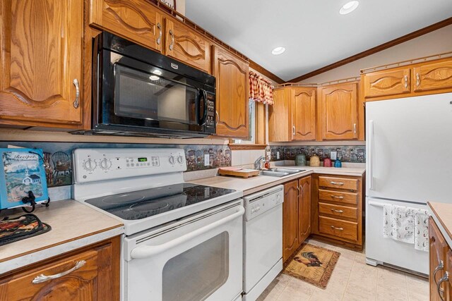N5101 Lueck Ln, Princeton, WI 54968 - kitchen featuring white appliances, lofted ceiling, a sink, tasteful backsplash, and crown molding