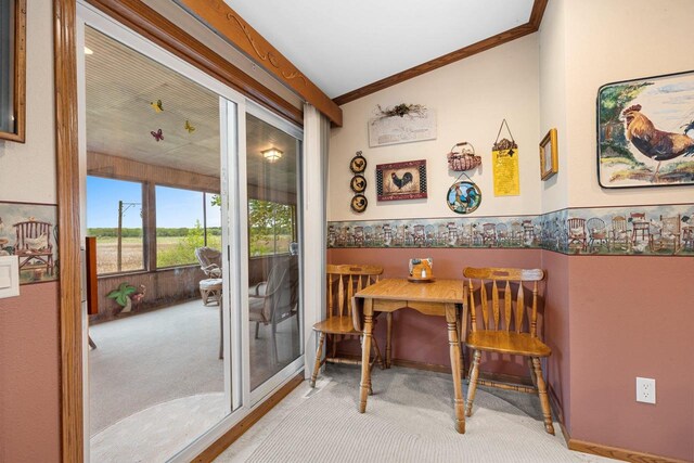 N5101 Lueck Ln, Princeton, WI 54968 - dining area with lofted ceiling, carpet floors, ornamental molding, and wainscoting